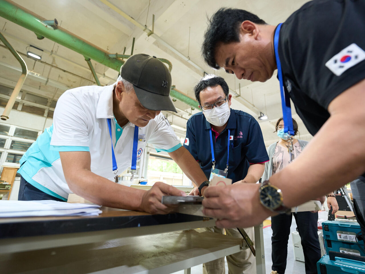 WorldSkills experts measure wood on a bench at a Skills Cooperation Workshop hosted by WorldSkills Chinese Taipei in June and July 2024.
